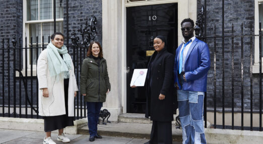 Campaigners stand outside No.10 Downing Street